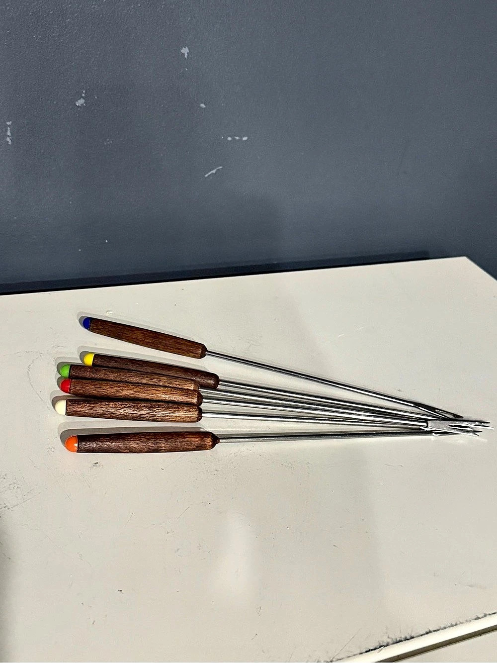 six vintage MCM stainless steel fondue forks w/ wood handles and color-coded tip